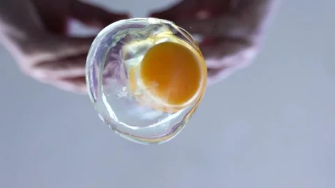 The knife breaks the egg and falls on the pan Stock Footage 130667825