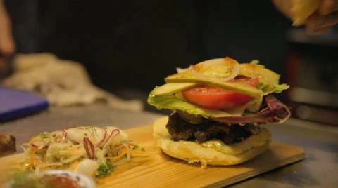 Knife in Burger in Restaurant Kitchen Stock Footage 42428352