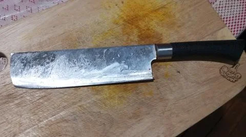 Knife on the chopping board Stock Photos