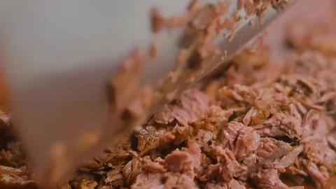 Knife chopping braised beef on board. Mexican food. Making tacos Stock-Footage 294893561