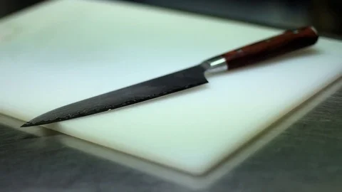 Knife on Copping board Stock Footage 72922402