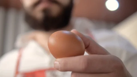 With a knife cut the egg Video stock 93387342