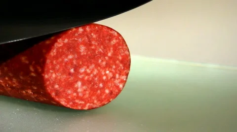 Knife cut slice from sausage Stock Footage 1084112