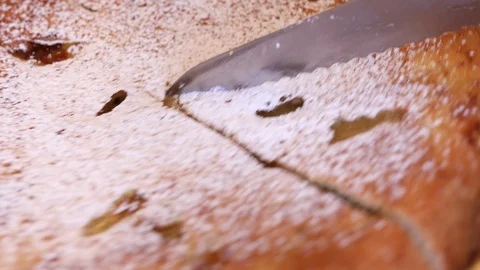 Knife cuts apple pie to pieces Stock Footage 128805582
