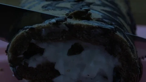 Knife cuts cake roll Video stock 81353465