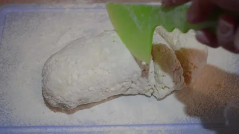Knife cuts dough from cottage cheese Stock Footage 132216129