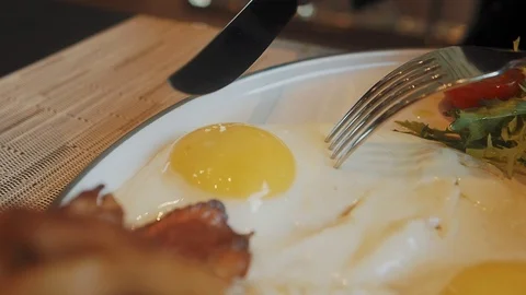 The knife cuts the egg yolk in half Stock Footage 124113733