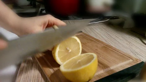 Knife cuts the lemon Stock Footage 72915767