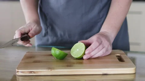 Knife cuts lime in half. Stock Footage 291765086