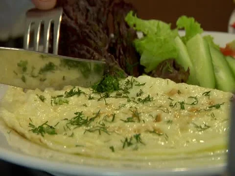 Knife cuts the omelette Stock Footage 22151048
