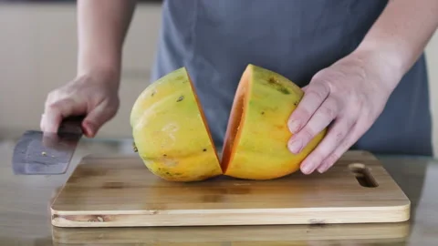 Knife cuts papaya in half. Stock Footage 291611859