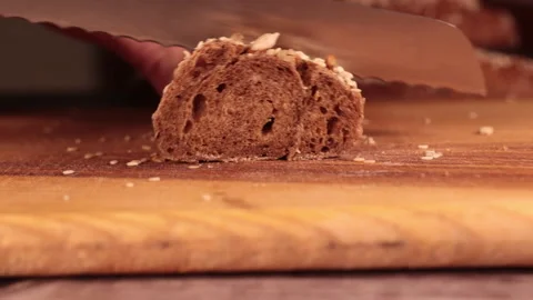 The knife cuts off a piece of bread Video stock 169167418