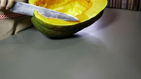Knife cuts a pumpkin Stock Footage 76979015
