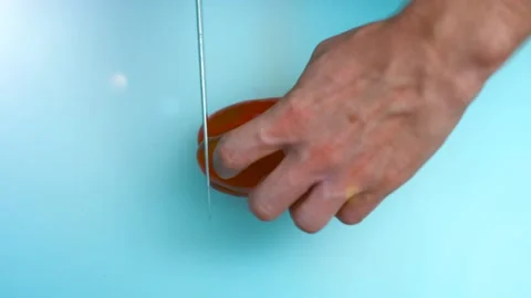 Knife cuts the red pepper Stock Footage 134469824