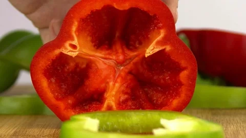 The knife cuts off a red pepper ring Stock Footage 83630163