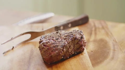 Knife cuts through hot roast, Witness the perfect marbling of the roast Stock Footage 336581790