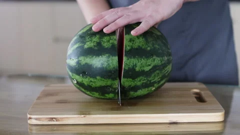 Knife cuts watermelon in half. Stock Footage 291766813