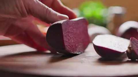 Knife Cutting Beetroot on Wooden Board Video stock 334338199