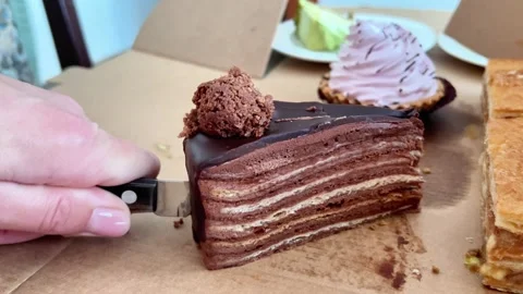Knife Cutting Into Layered Chocolate Cake Slice Inside Cardboard Delivery Box Stock Footage 346176781