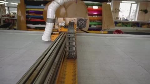 Knife of cutting machine operates with fabric in workshop Stock Footage 236908520