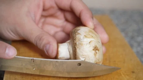 Knife cutting mushrooms Stock Footage 71471179