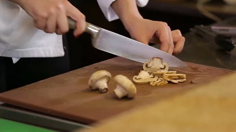 Knife cutting mushrooms Stock Footage 74716140