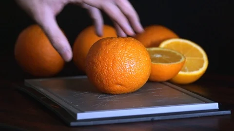 Knife Cutting Oranges On Cutting Board Stock Footage 125179622