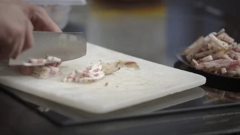 Knife cutting pork cheek Stock Footage 82022579
