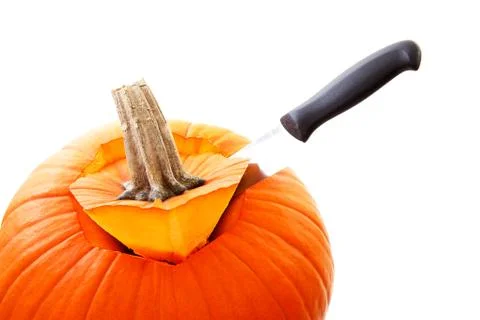 Knife is cutting in pumpkin Foto stock