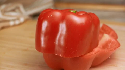 Knife cutting red bell pepper in slow motion Stock Footage 152902979