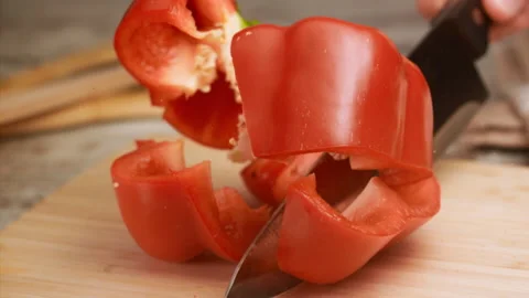 Knife cutting red bell pepper in slow motion Stock Footage 152904764