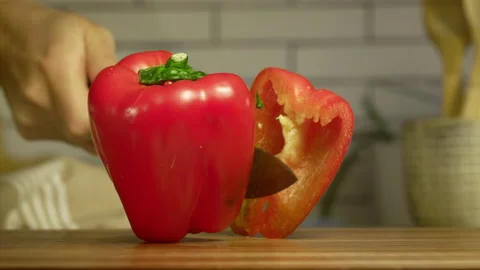 Knife cutting red bell pepper in slow motion Stock Footage 152905003