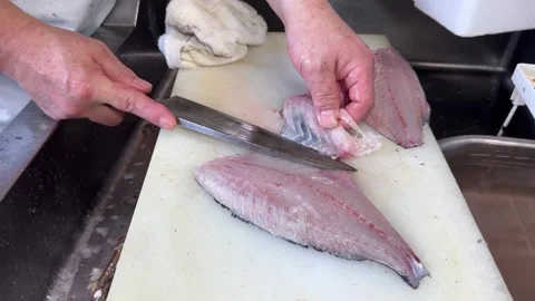 Knife Cutting Rib Bones from a Pink Fish Fillet (Mejina, Gure), Japanese Food Stock Footage 343174437