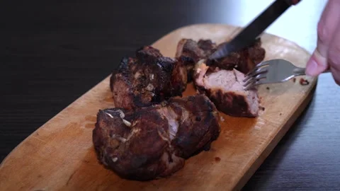 Knife cutting roasted meat kebab on wooden desk, grilled meat kebab Stock Footage 264947652
