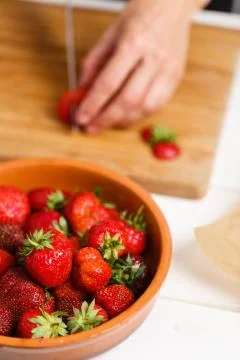 Knife cutting a strawberry Stock Photos