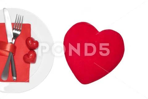 Knife, fork and hearts on the plate. Valentine's day concept. Stock Photos