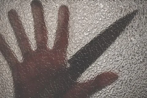 Knife in hand. Aggressive tin attack. Hacking attempt. The criminal behind the Stock Photos