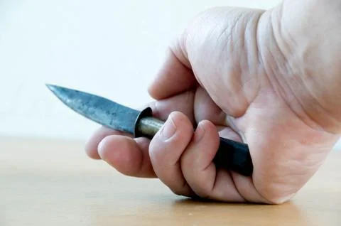 Knife in hand Stock Photos