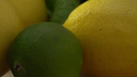 Knife handle, lime, lemon and mint leaves on a cutting board Stock Footage 146661832