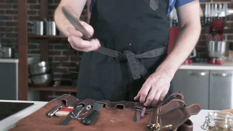 Knife In Hands of Chef In Restaurant Kitchen. Preparing Cooking Food. 動画素材 142807109