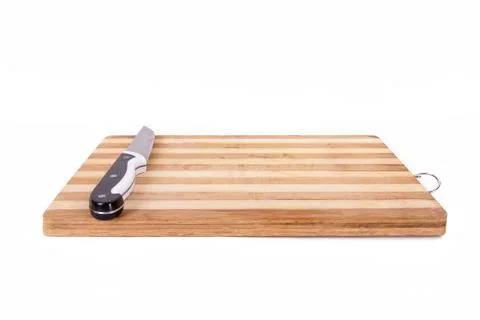 Knife on hardboard Stock Photos