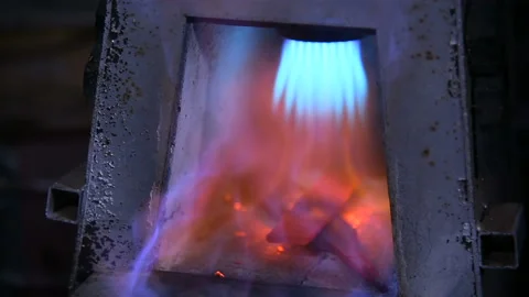 The knife is heated in a gas oven by a blacksmith. Forging knife. Stock-Footage 85901695