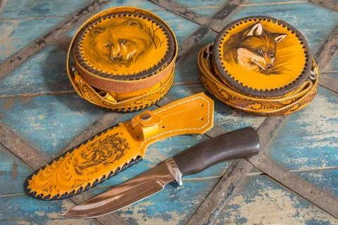Knife with leather sheath and flasks Stock Photos