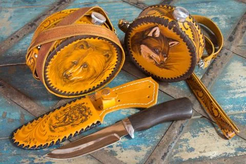 Knife with leather sheath and flasks Stock Photos