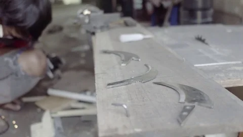 Knife maker cutting the karambit blade Stock Footage 73375738