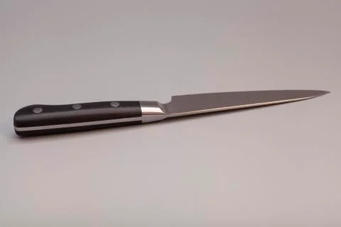 Knife over gray background Fotos Stock