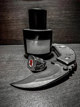 Knife, perfume, ring Stock Photos