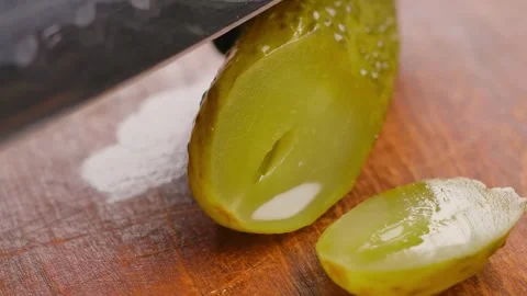 Knife pickled cucumber half rings Stock Footage 302849626