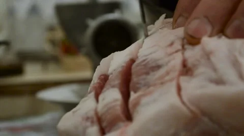 Knife Pierces Meat Cutting it Into Pieces. Focus Transfer From Knife on Meat Stock Footage 61522034