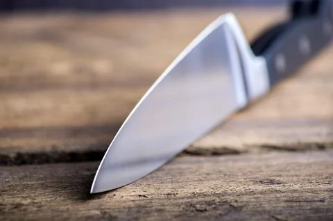 Knife on rustic kitchen table with copy space Stock Photos